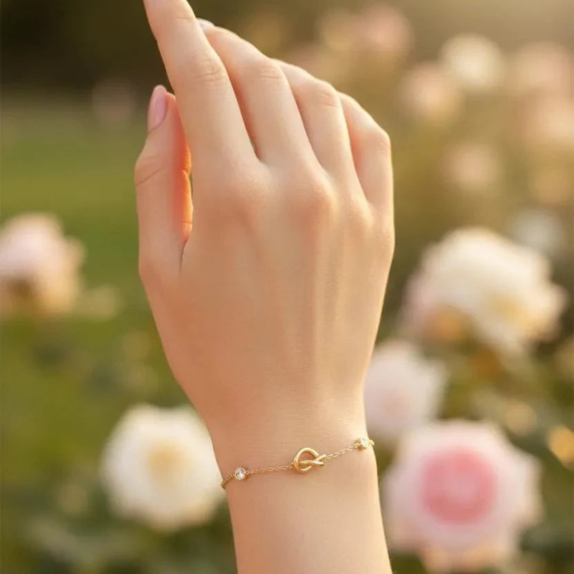 Gold Plated Chain Bracelet Featuring A Knot Motif